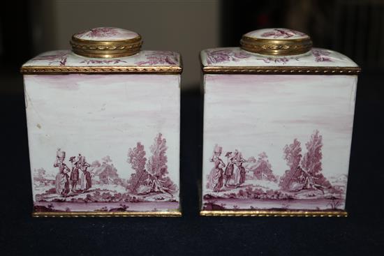 A pair of South Staffordshire enamel tea caddies and covers, and two similar candlesticks, late 18th century, 6.25in. and 10in., candle